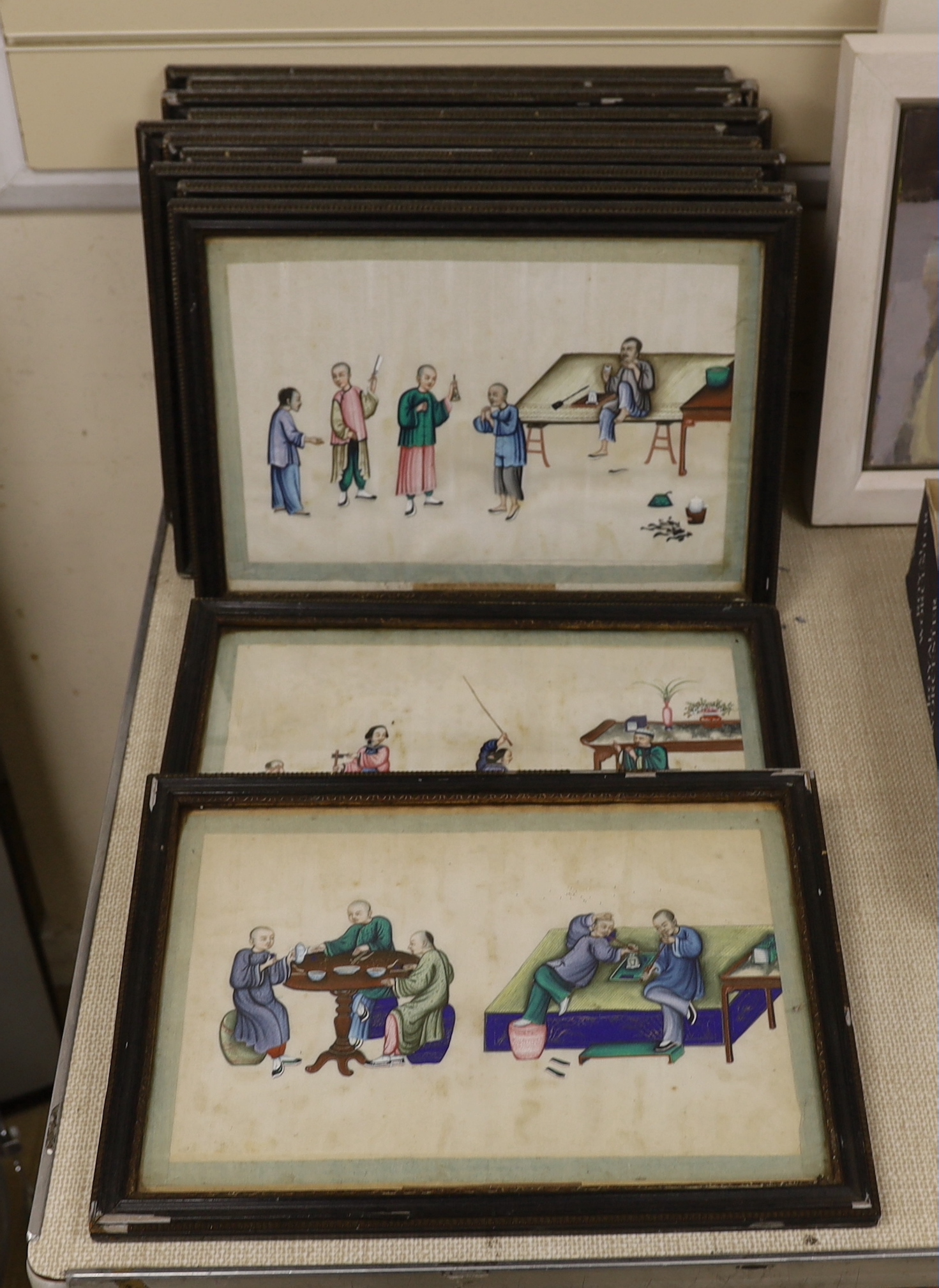 19th century Chinese school, set of 12 pith paper paintings, figures smoking opium pipes, each 32 x 20cm